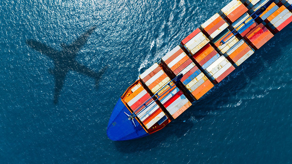 Cargo ship with colorful containers sails on blue sea; airplane shadow casts over water, creating a dynamic aerial scene.