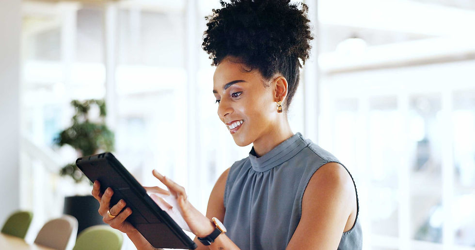 Forecasting - woman smiling looking and entering content into a device
