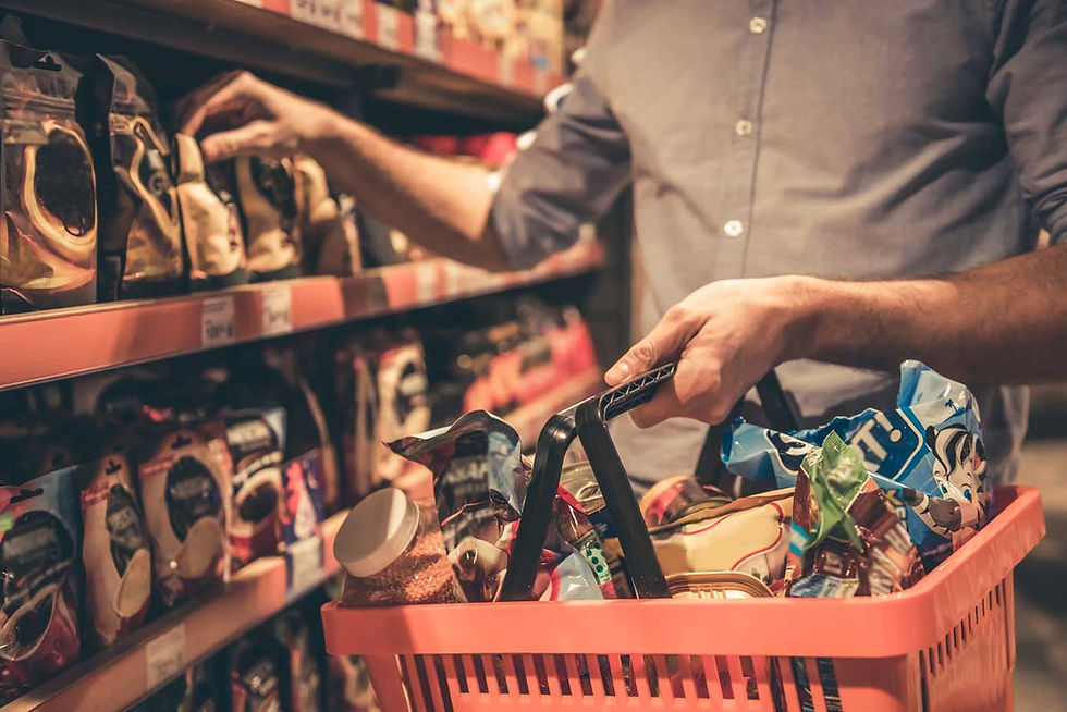 Person picking food from aisle