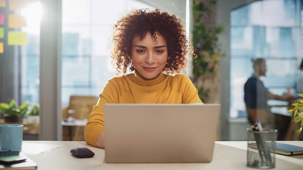 Media Lift - a woman busy working on a laptop