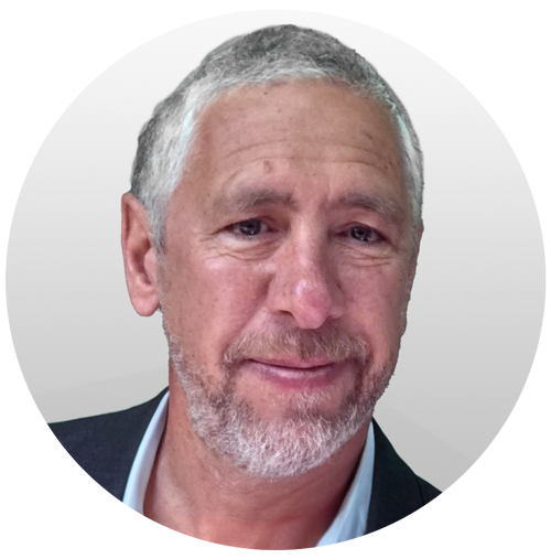 Headshot of a smiling man with gray hair and beard, Circana.