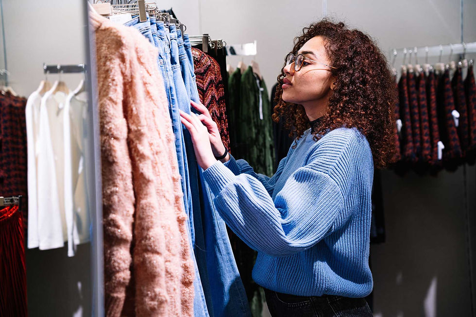 Growth Predictor - woman looking through rails of clothes