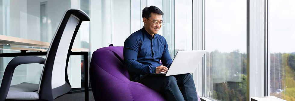 Person on a chair on a laptop