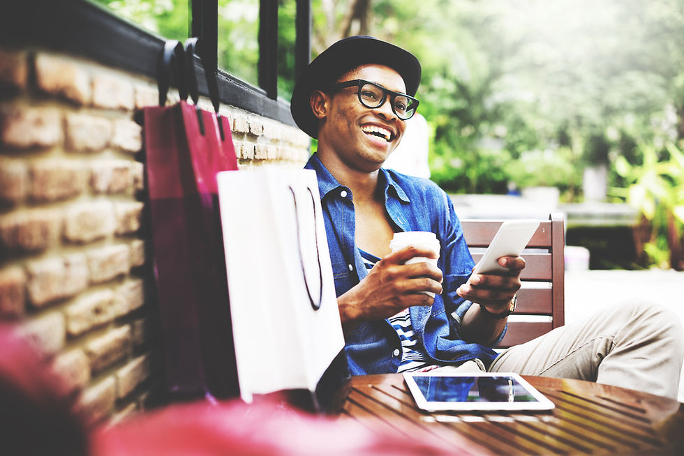 Man smiling with phone.jpeg